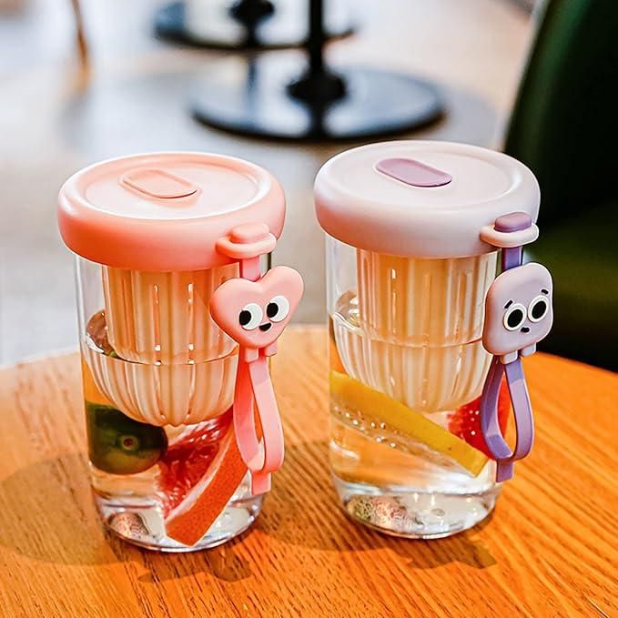 THE GIR FARMER glass smoothie tumbler with lid in pink and purple with fruit infuser and cute character charm