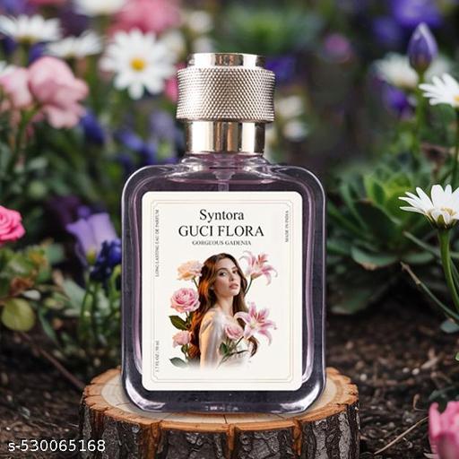 THE GIR FARMER perfume bottle featuring Gucci Flora scent with floral design on a wood slice outdoors