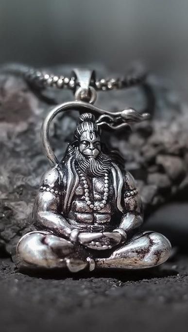 Intricate Hanuman silver locket featuring a seated Hanuman figure with detailed craftsmanship
