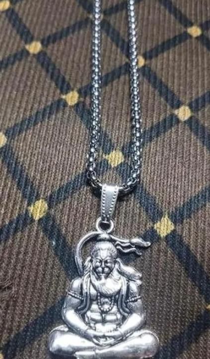 Hanuman silver locket with intricate detailing, hanging from a silver chain for spiritual wear