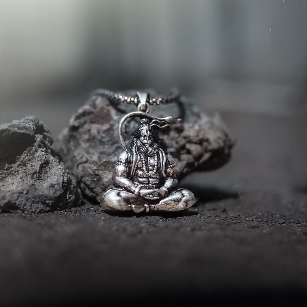 Hanuman silver locket featuring a detailed depiction of Lord Hanuman in a sitting position