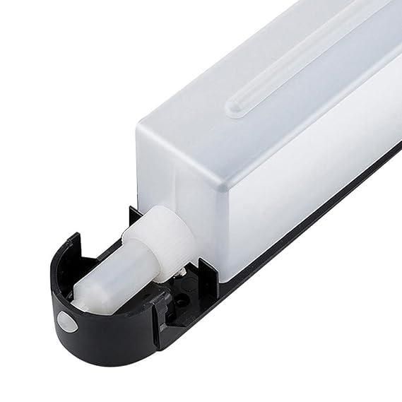 wall mounted soap dispenser close up showing rectangular translucent reservoir with black base and nozzle