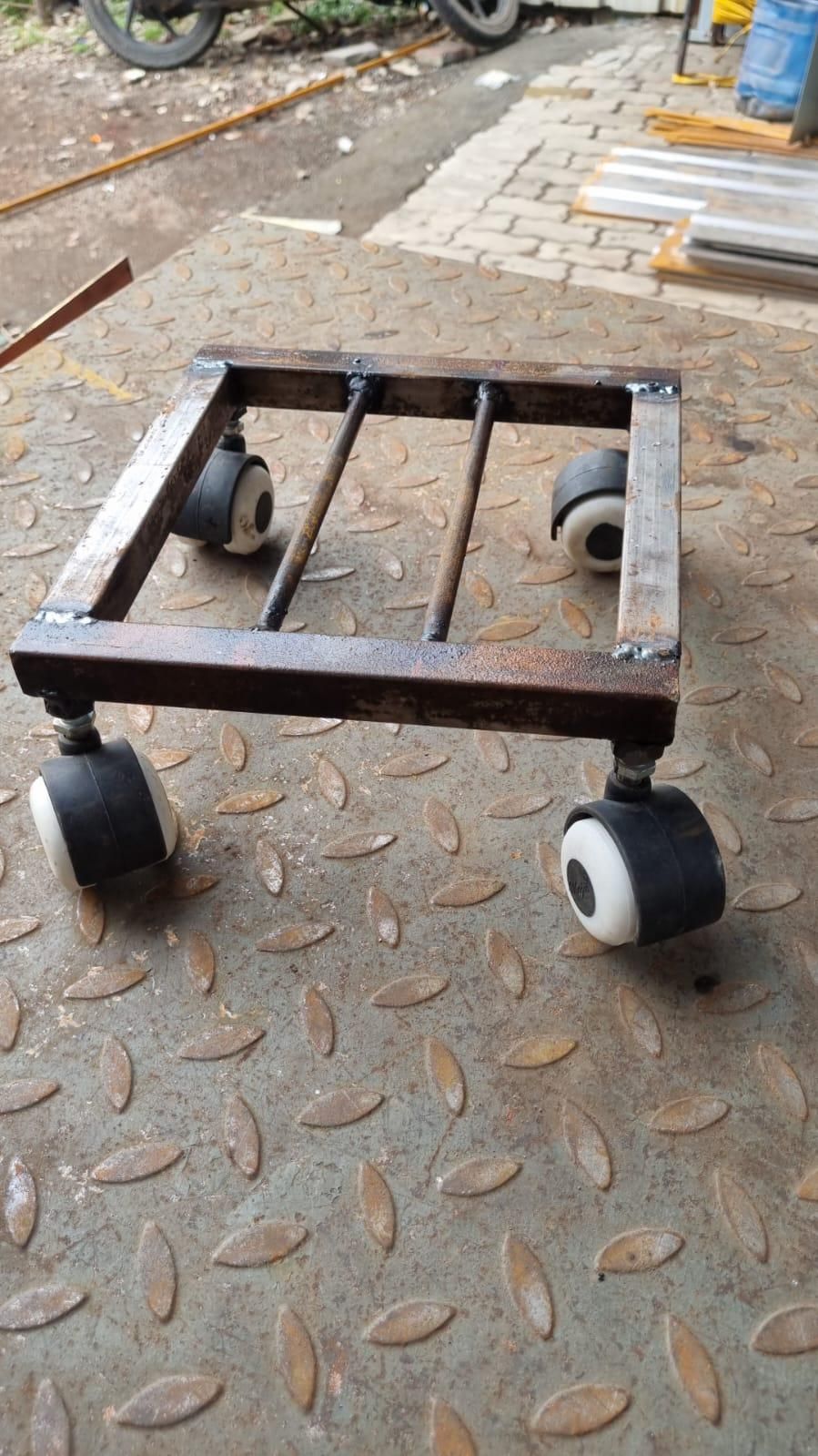 Rustic wooden indoor planter stand on wheels with black caster wheels for easy mobility