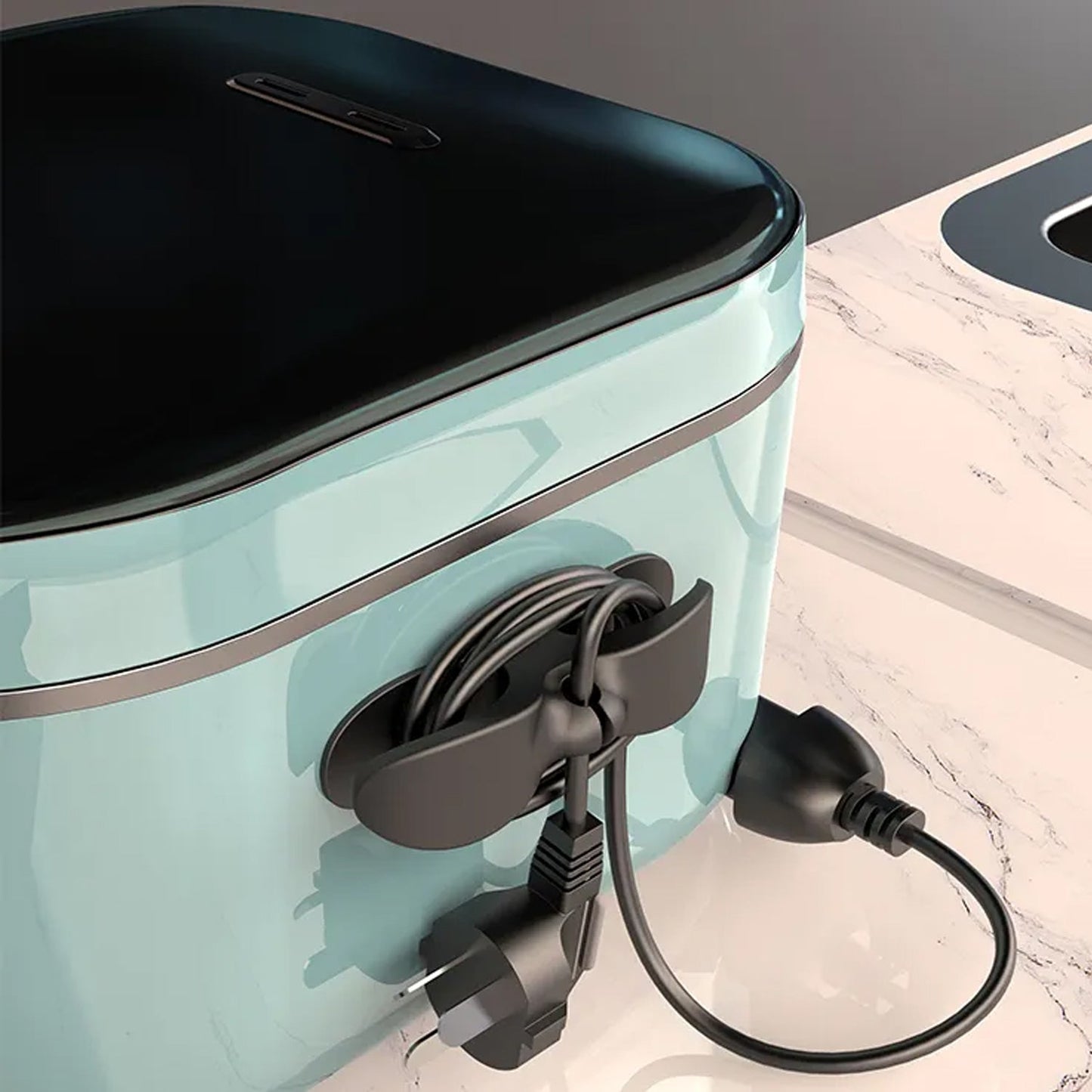 Appliance cable organizer attached to a kitchen appliance, keeping cords tidy and organized