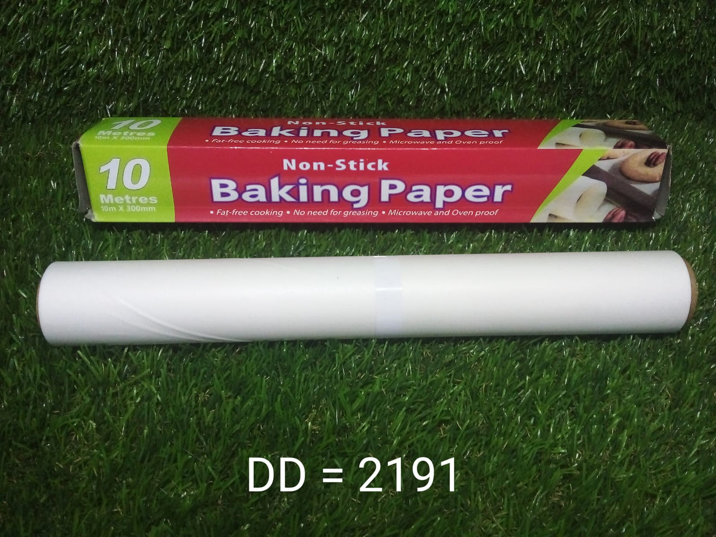 Your Brand non stick baking paper roll and 10 meter box on grass showing microwave oven safe baking paper