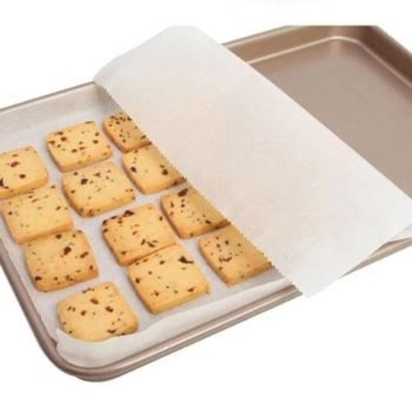 Your Brand microwave oven safe baking paper on baking sheet with cookies nonstick and heat resistant