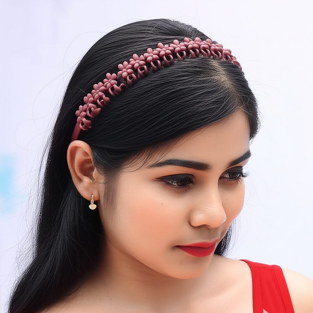 Woman wearing a maroon floral design korean style hair accessories headband