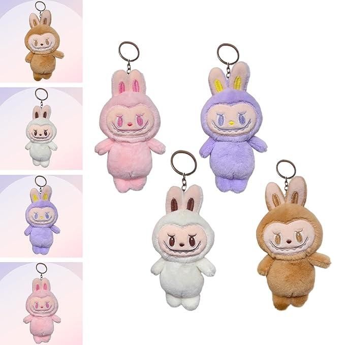 Set of four colorful Labubu plush doll keychains in brown, pink, white, and purple with bunny ears