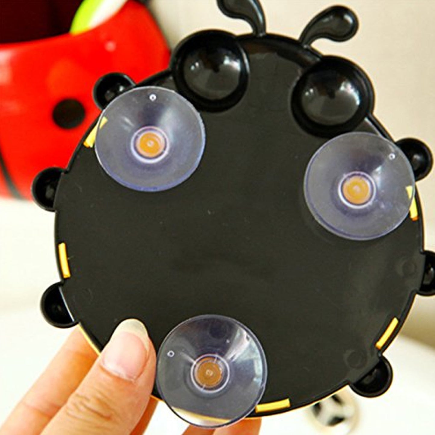 Ladybug toothbrush holder with suction cups for easy bathroom mounting and fun decor