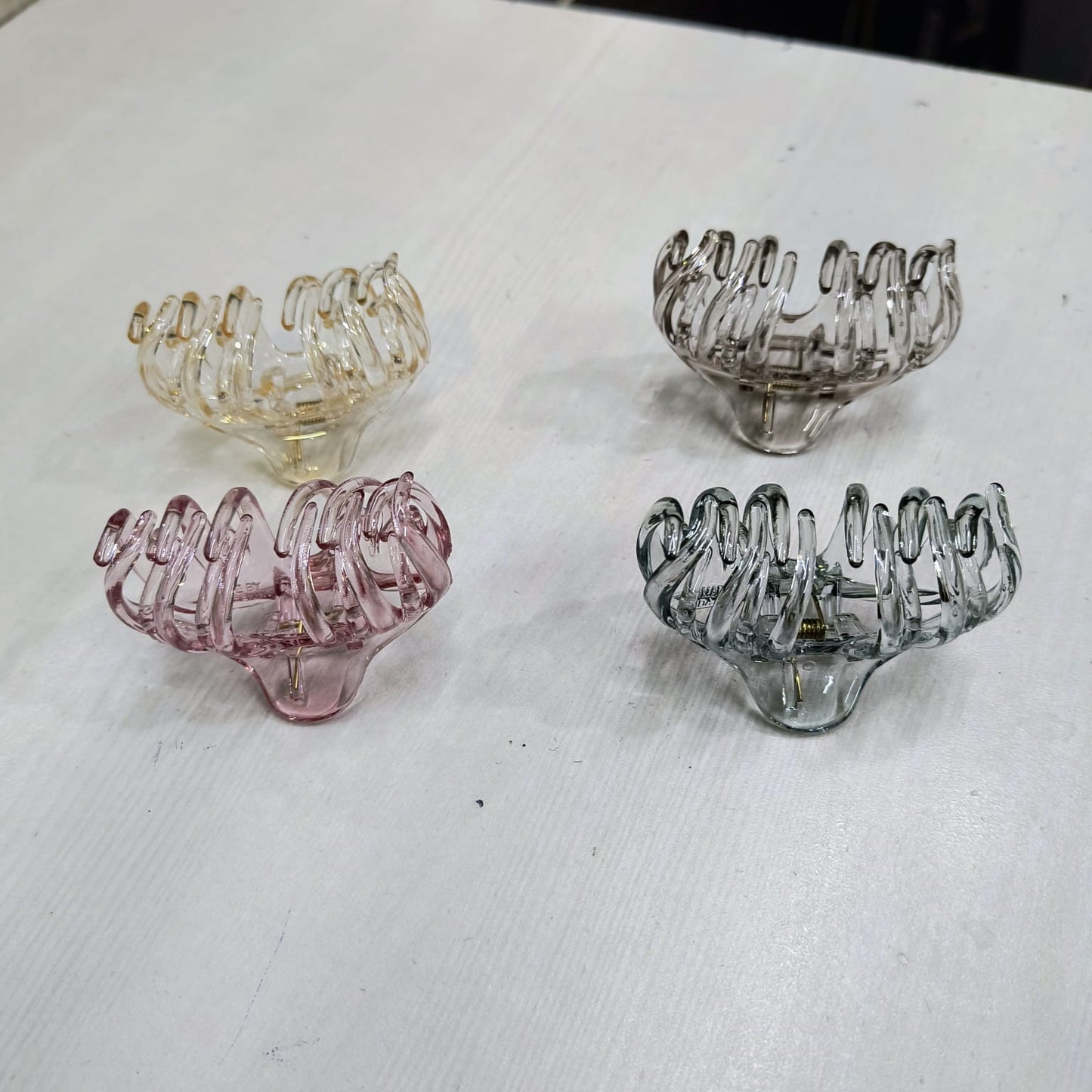 Large claw clip for thick hair in pink, beige, gray, and green translucent colors