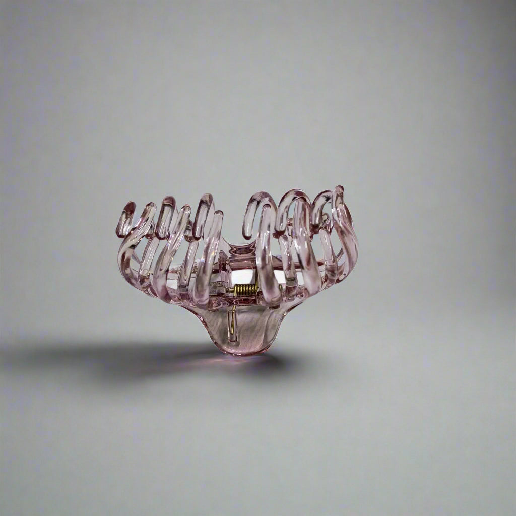 Large claw clip for thick hair in transparent pink plastic design