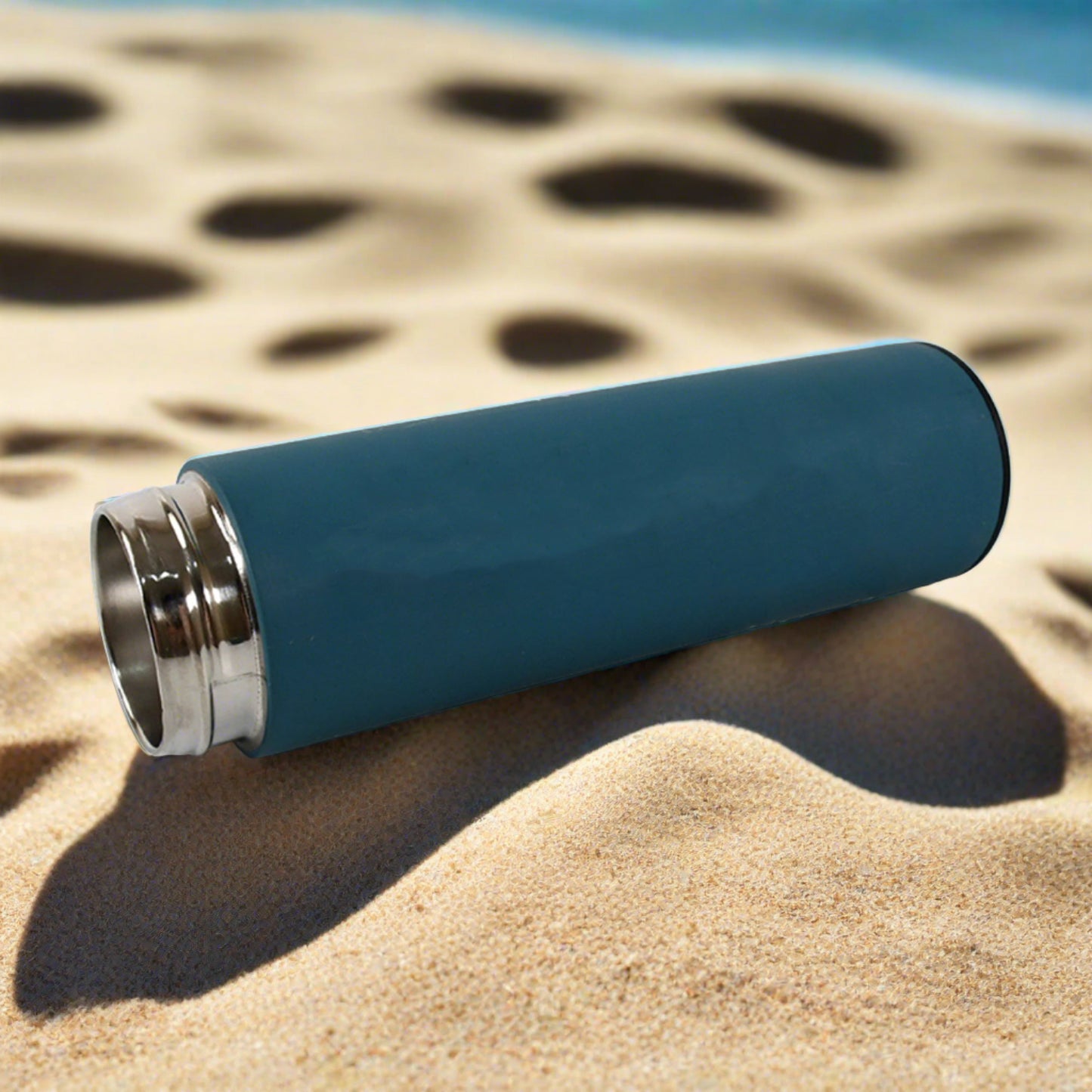 Wukusy leak proof fridge bottle 500ml in blue color with sleek design on sandy beach