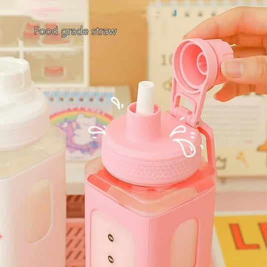 Pink leakproof kawaii bottle with lid featuring a food grade straw and flip-top cap