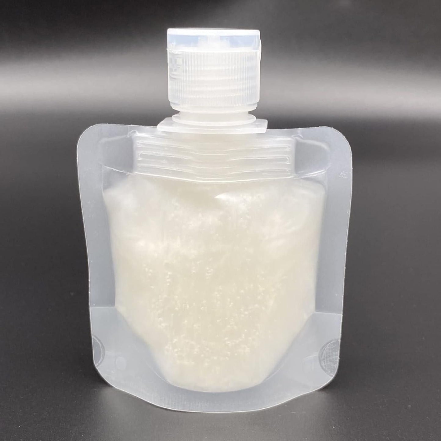 Clear leakproof travel pouches for liquids with white screw cap by THE GIR FARMER