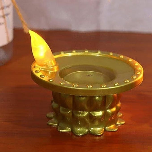 Golden LED water pouring diya light with a traditional design and glowing flame effect