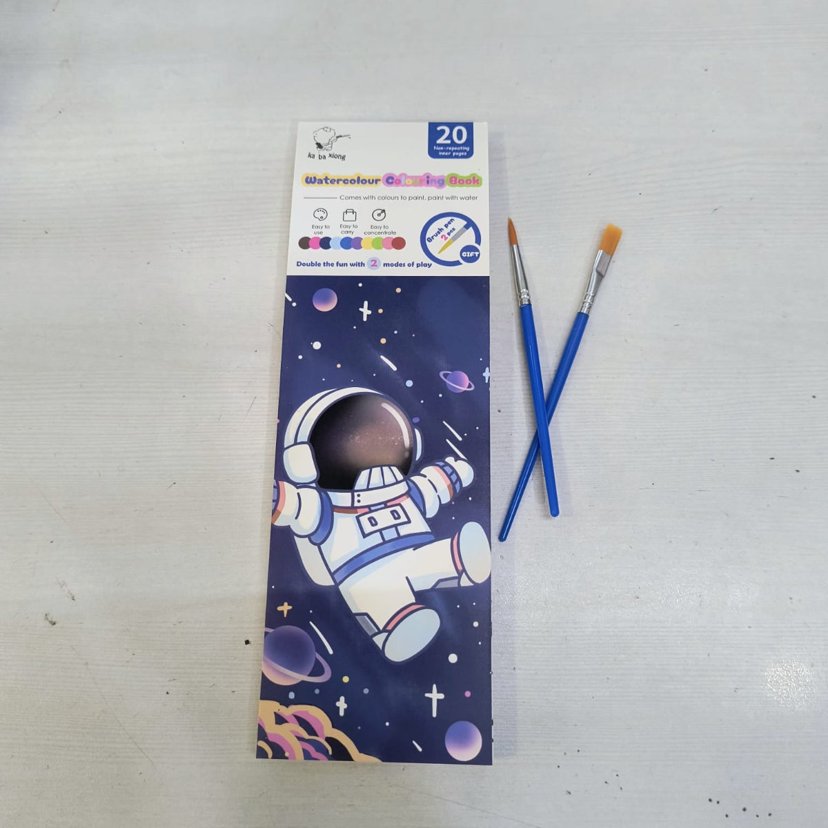 Magic water coloring book for kids with astronaut space theme and two blue paintbrushes