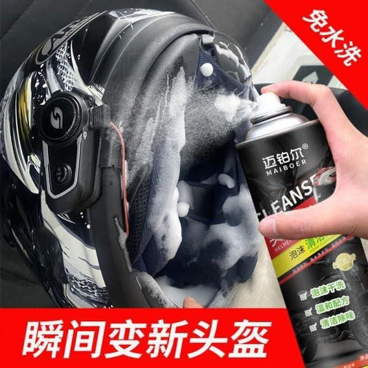 Helmet dry cleaning spray being applied to the interior padding of a black motorcycle helmet