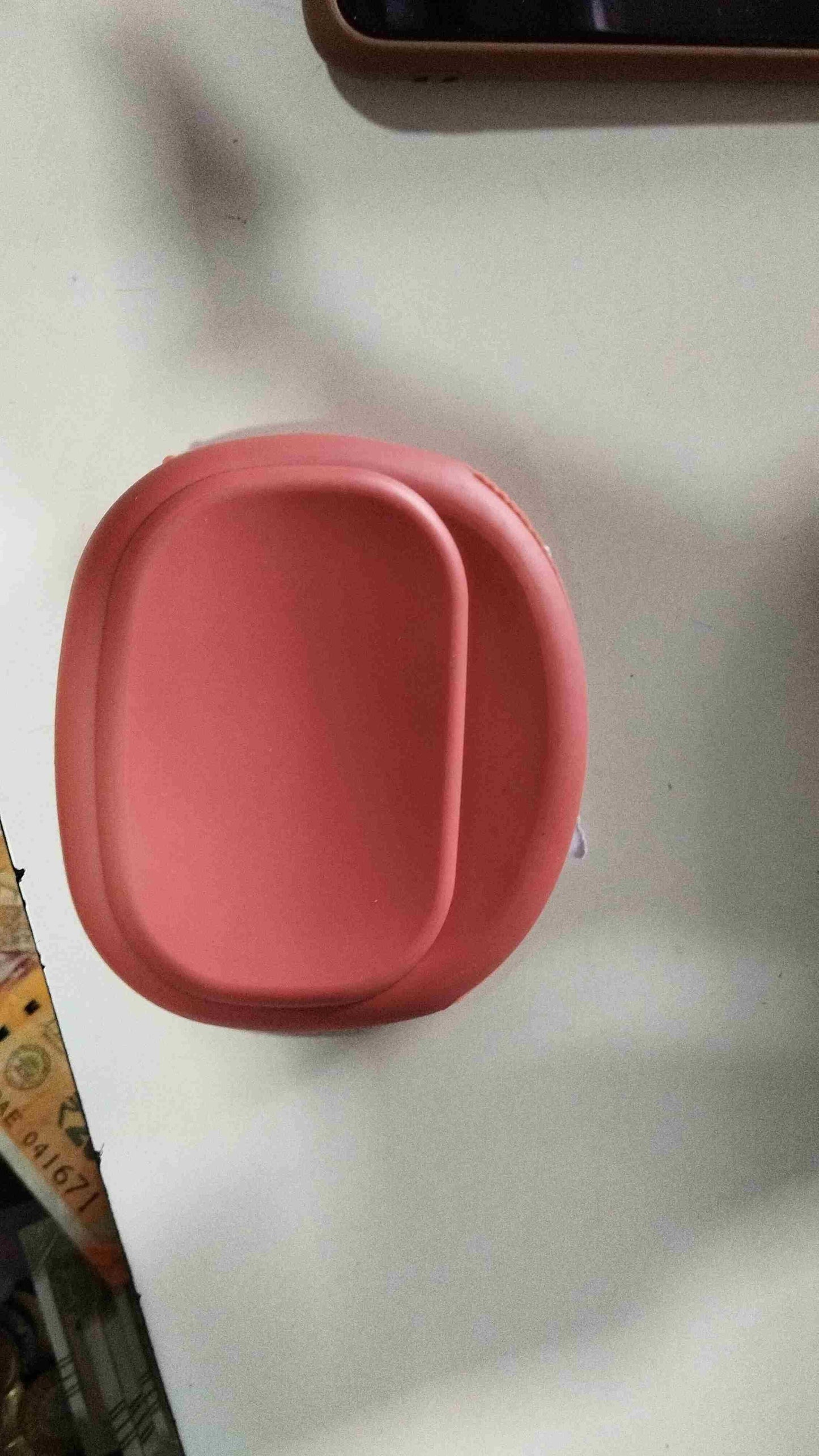 THE GIR FARMER pink mini silicone earbud holder designed to keep earbuds secure and tangle-free