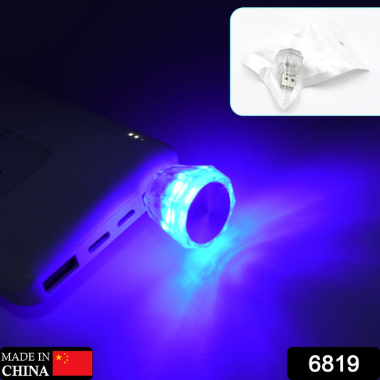 Mini USB LED car light emitting a blue glow, designed for easy plug-in and use in vehicles