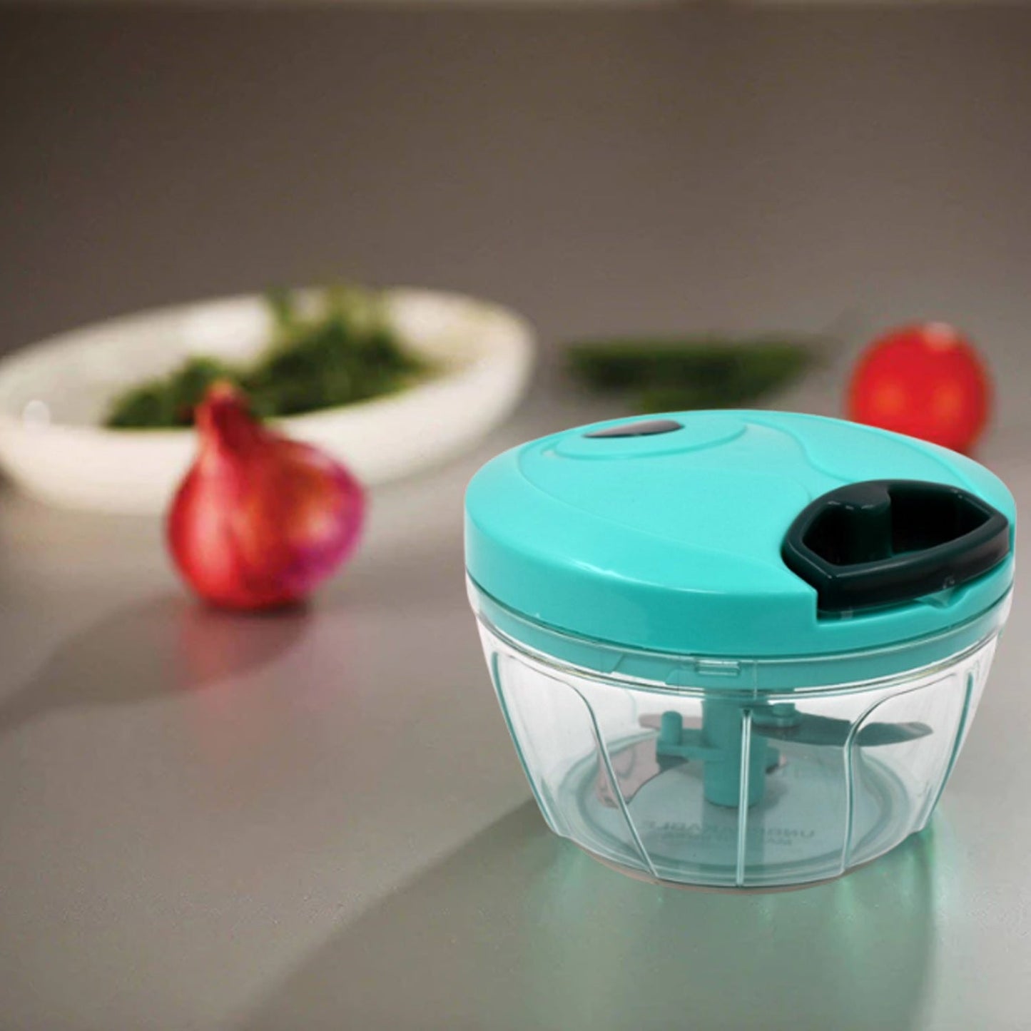 Wukusy mini vegetable chopper with a turquoise lid and clear bowl for efficient food preparation