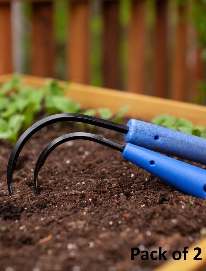 Mini weeder pack for raised beds with two blue-handled gardening tools on soil