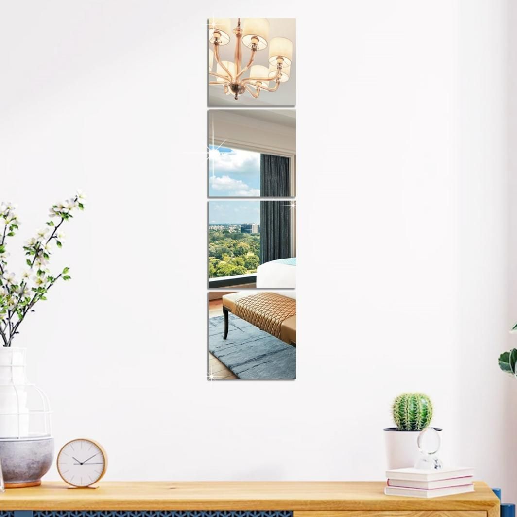 Modern acrylic mirror stickers for living room displayed as three vertical reflective panels on a white wall above a wooden surface with decor