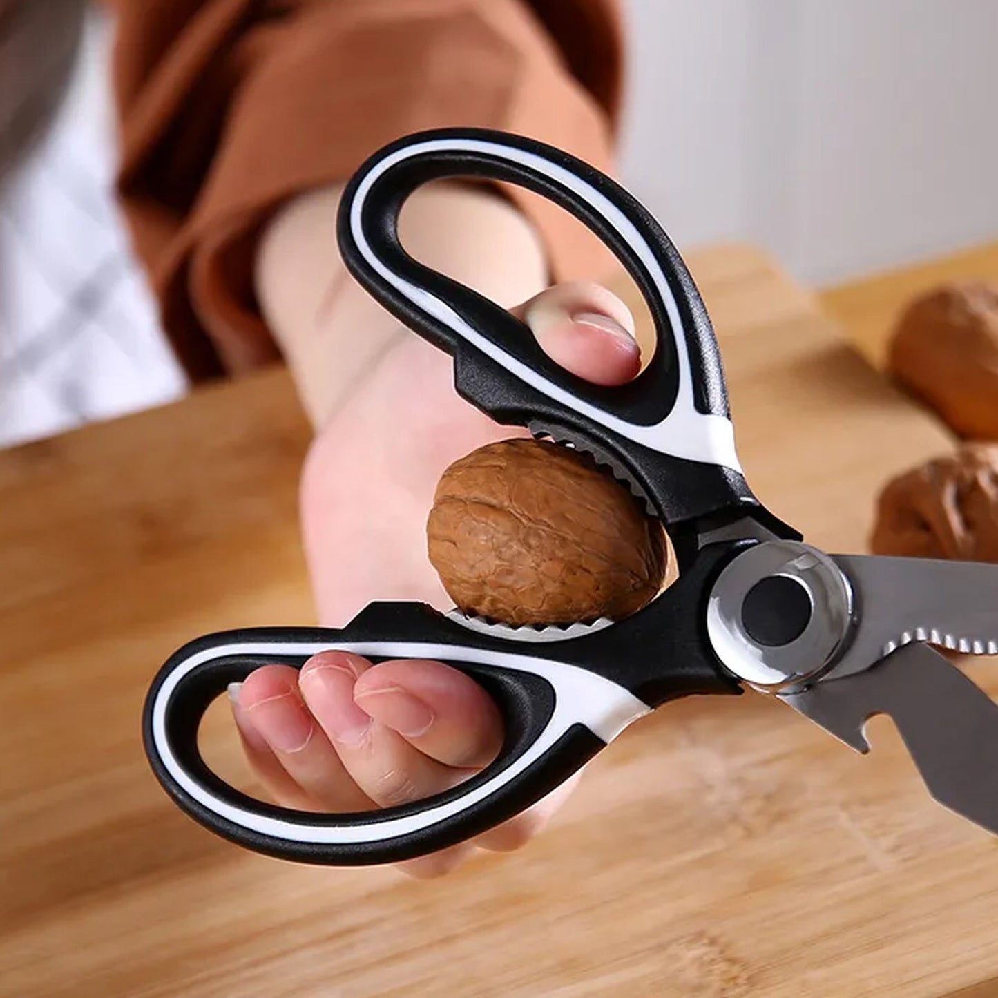 Multi function kitchen scissors designed for cutting, cracking nuts, and food preparation