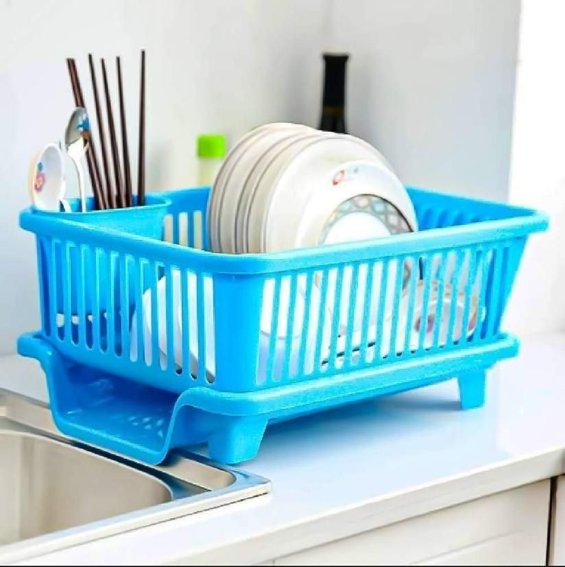 Blue multi-functional dish drying rack holding plates and utensils on kitchen countertop