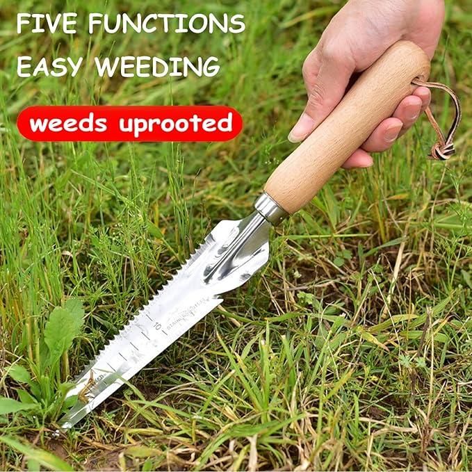 Hand using multi-purpose weed remover with wooden handle to uproot weeds from grass