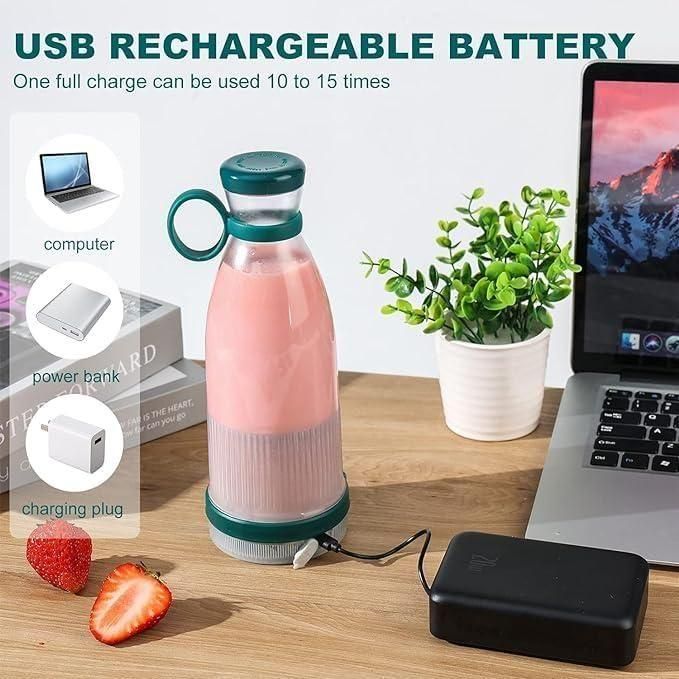 USB rechargeable compact blender for travel charging next to laptop and power bank on wooden table