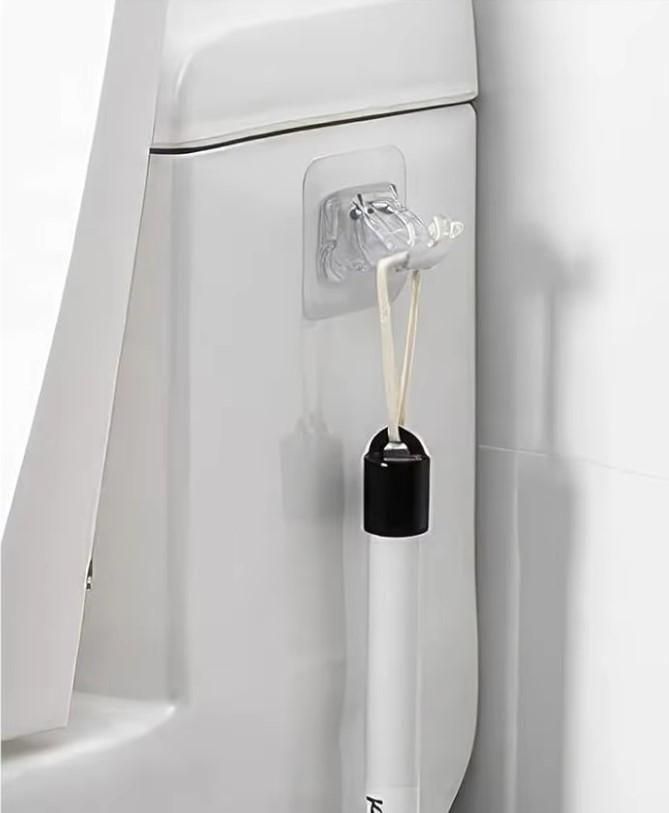 Multifunctional rod holder clips securely attached to white surface holding a lightweight rod