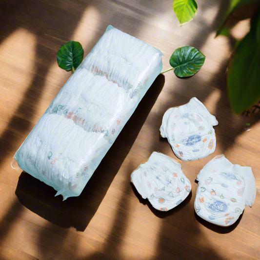 Pack of natural eco-friendly baby diapers alongside individual diapers presented on a wooden surface