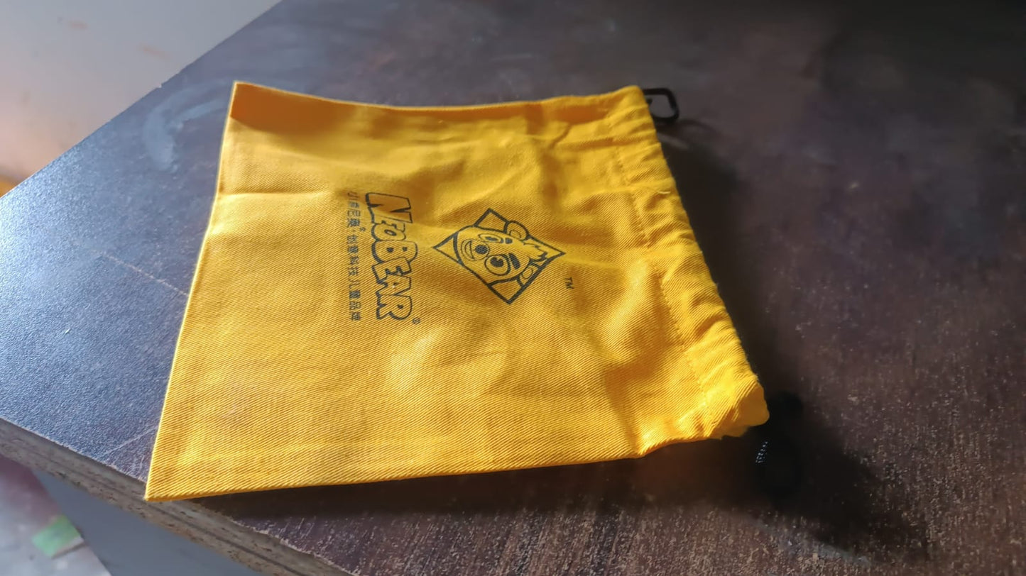 Heavy duty small dori bag in bright yellow with a drawstring closure and logo design