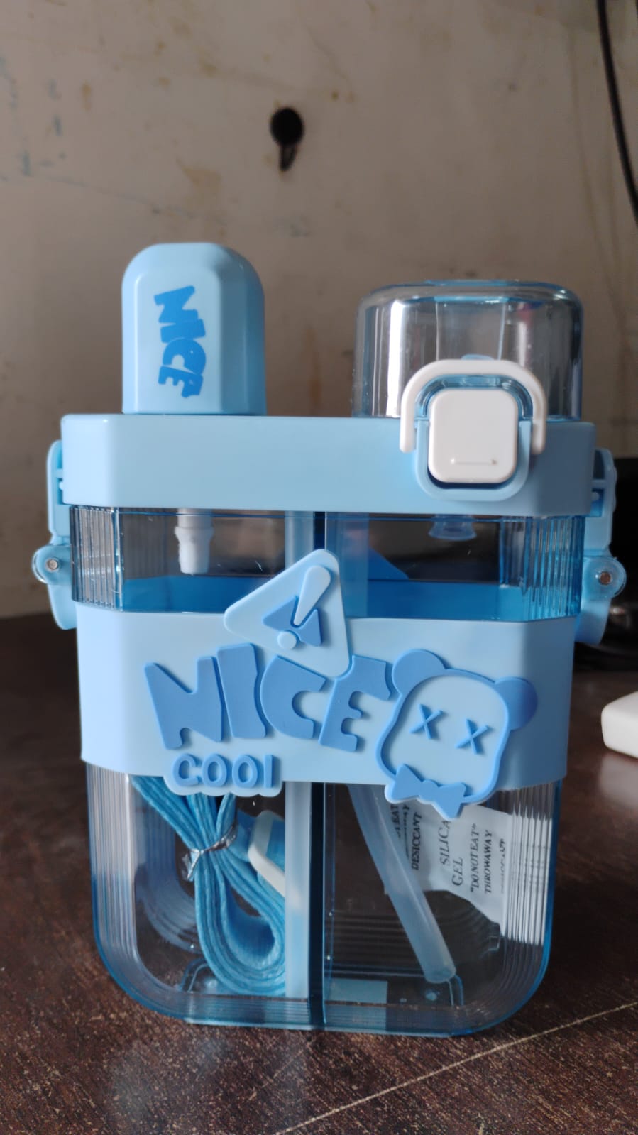 Wukusy dual compartment water bottle in blue with straw and storage features for convenient hydration