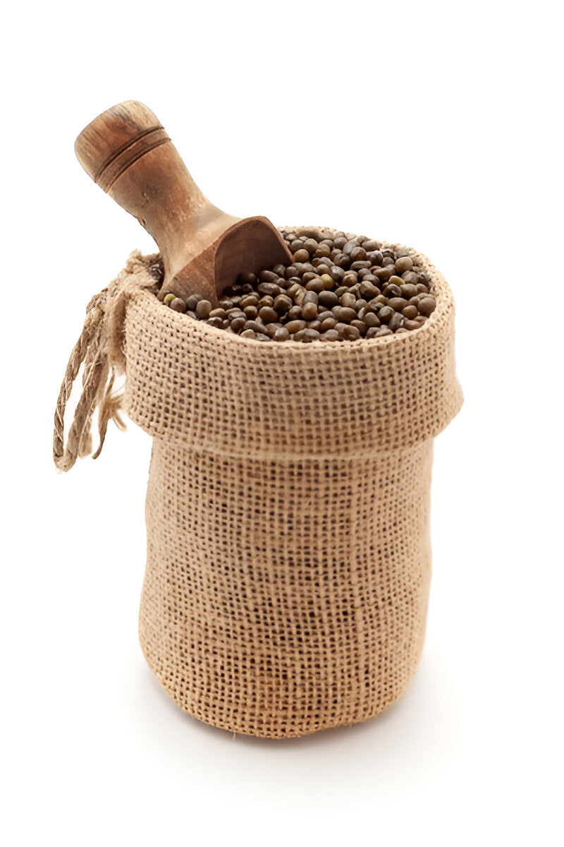 Organic green moong beans in a burlap sack with a wooden scoop from THE GIR FARMER