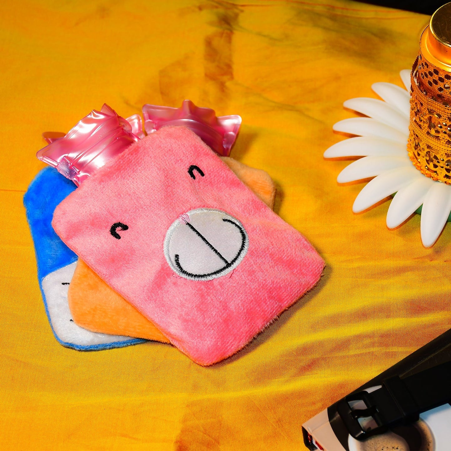 Pink hot water bag for cramps with a cute animal design, perfect for soothing pain relief