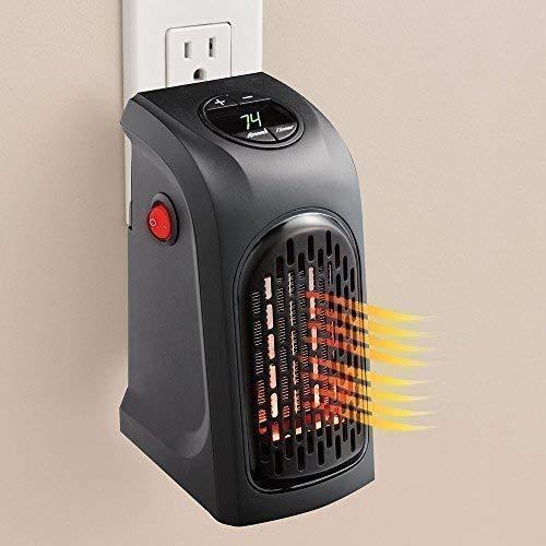 The Gir Farmer portable electric heater plugged into wall outlet with digital temperature display