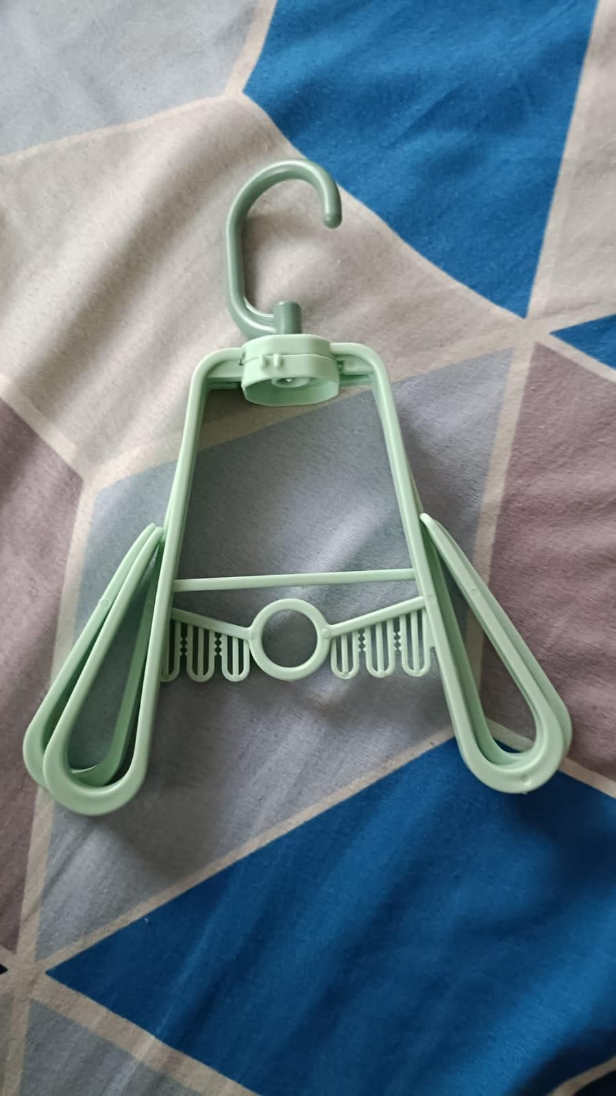 Light green portable shoe organizer hanger with multiple slots for shoes by THE GIR FARMER
