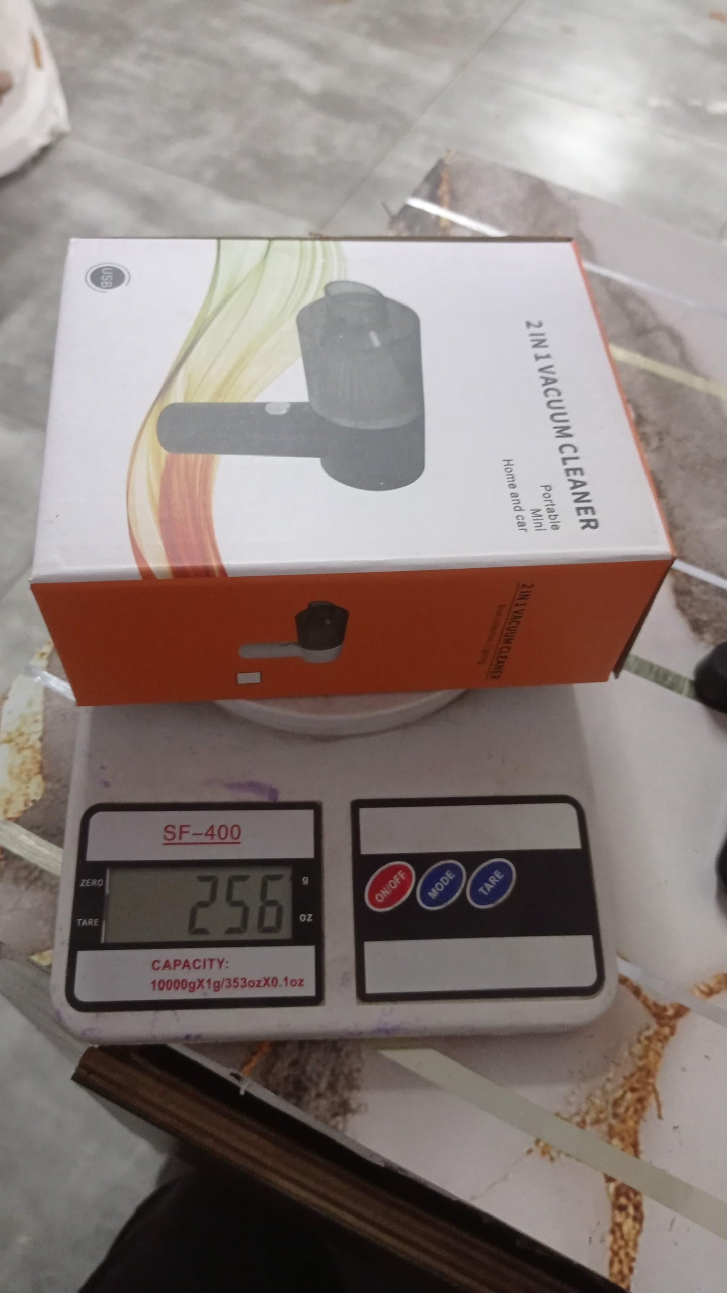 THE GIR FARMER portable vacuum cleaner for car interior boxed on digital scale showing weight