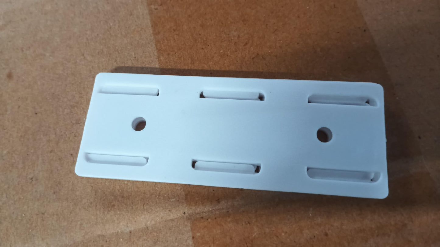 White plastic power strip wall mount pack of 4 with multiple slots and screw holes for secure attachment