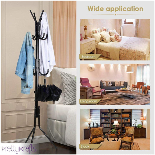 Black wrought iron coat rack stand holding jackets and umbrellas next to a sofa in a living room
