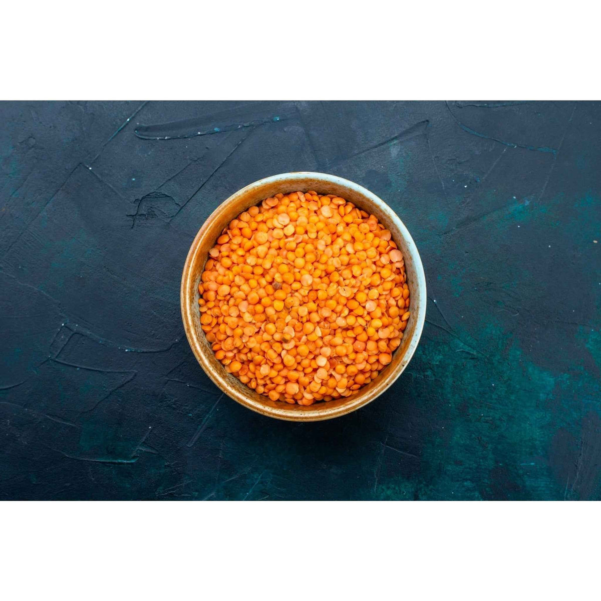 Bowl of orange lentils showcasing pure natural tur dal for healthy cooking and meal preparation