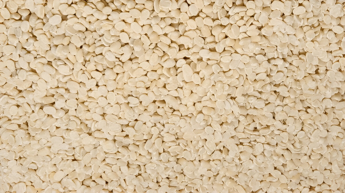 Close-up of pure urad dal for sale showing clean white split lentils from THE GIR FARMER