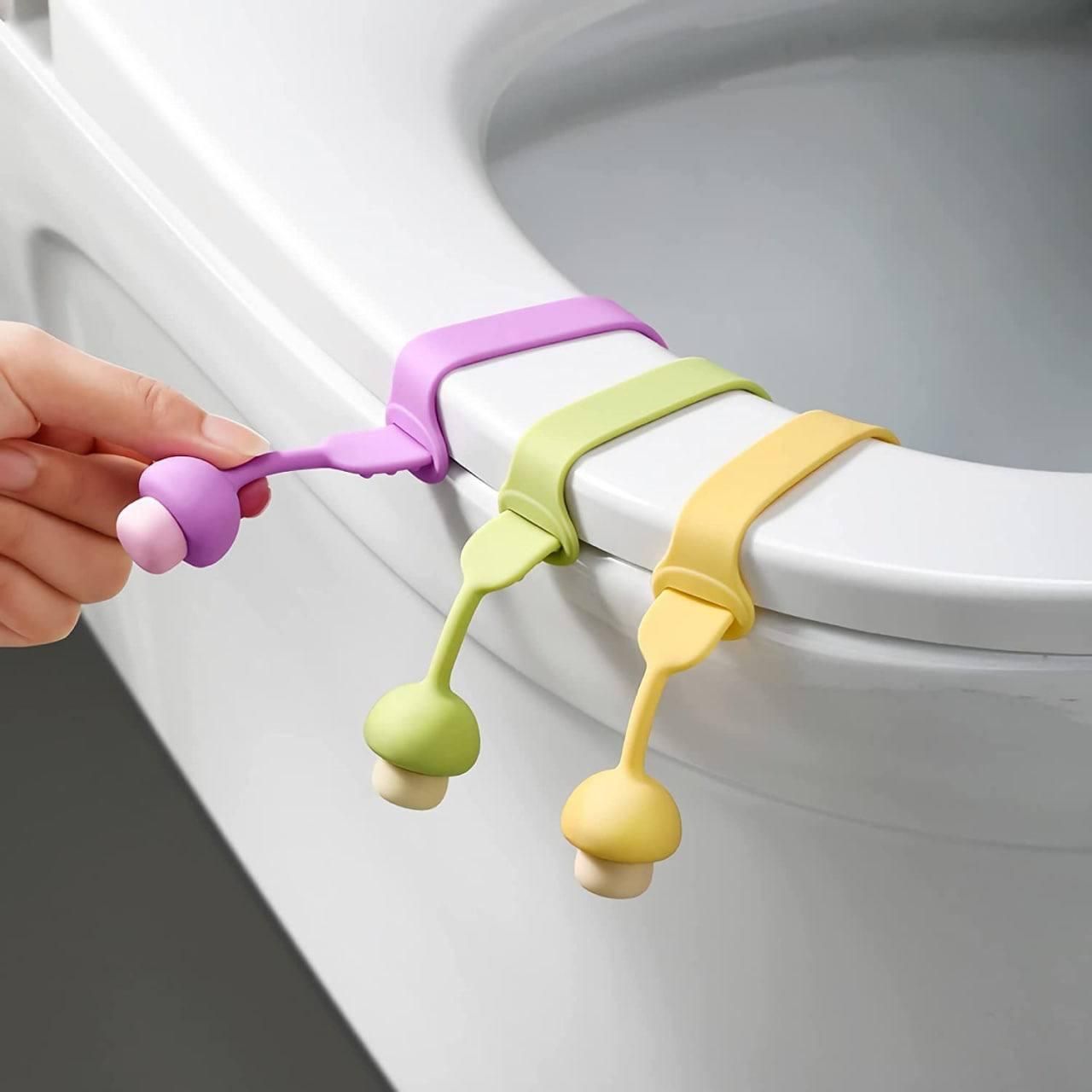 Colorful hygienic toilet lid lifter attachments in purple green and yellow for hands-free toilet lid handling