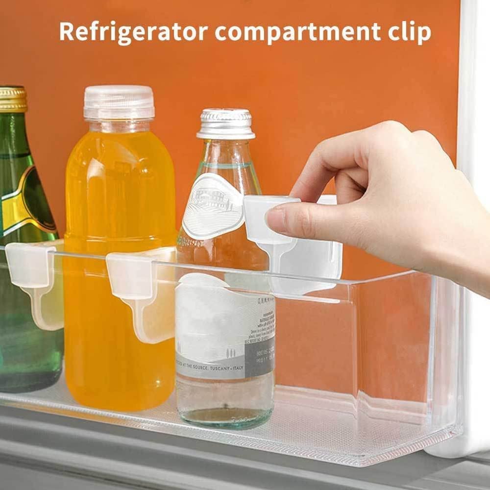 Clear refrigerator organizer bins holding drinks with easy access for efficient space management