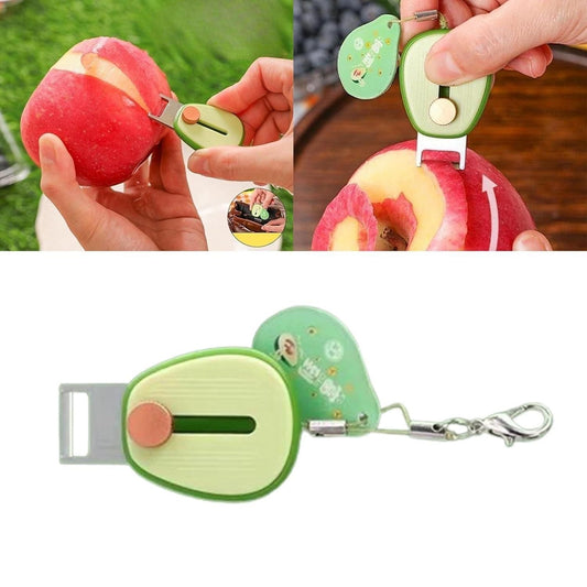 THE GIR FARMER retractable mini vegetable peeler in green with keychain, shown peeling an apple