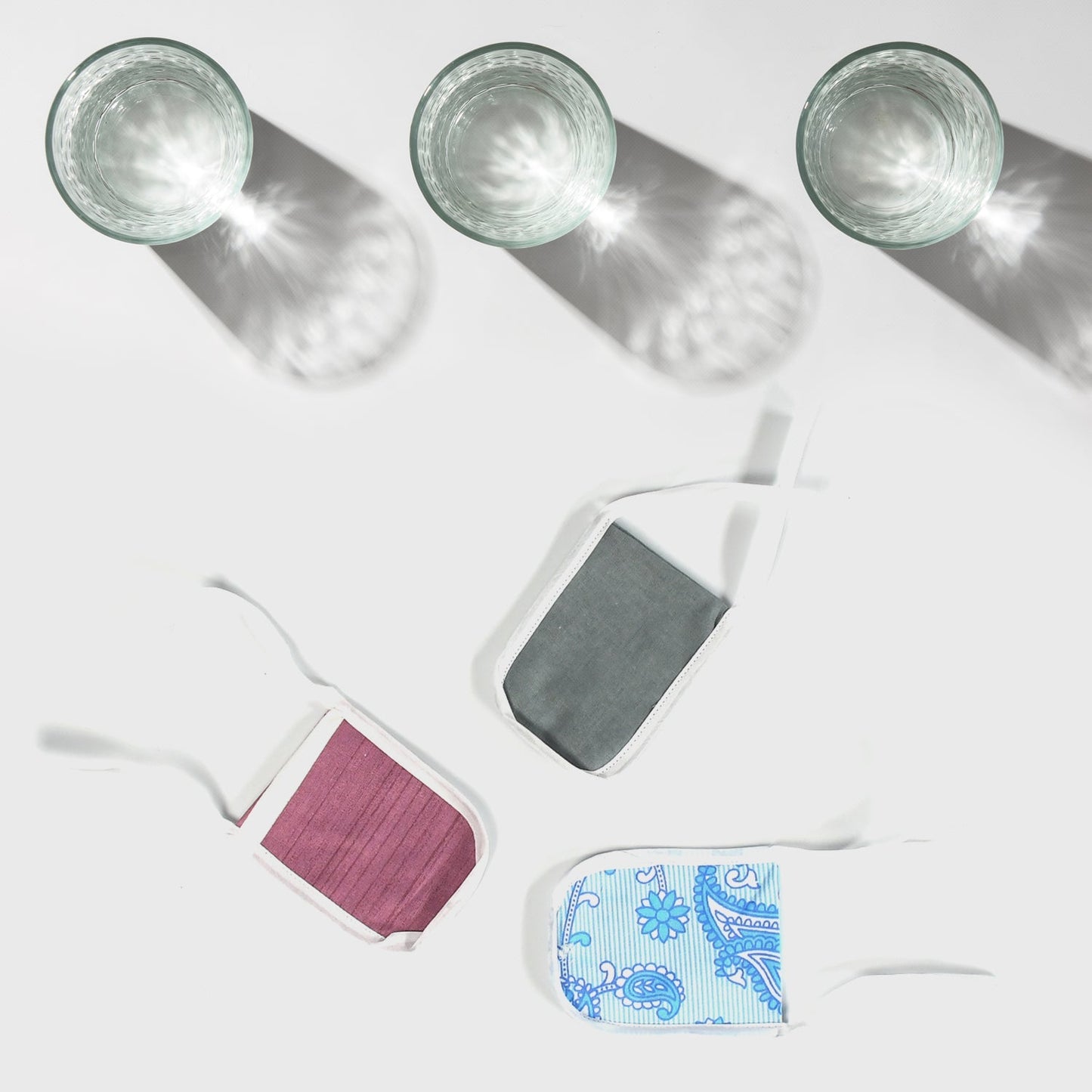 Four reusable cotton water filter covers in various colors and patterns for eco-friendly water filtration
