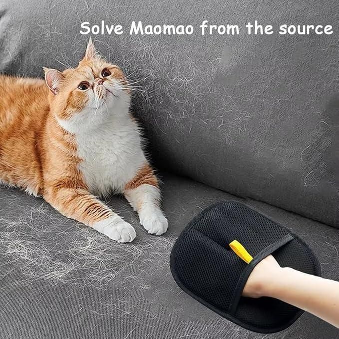 Black pet hair removal gloves removing orange cat fur from gray sofa with a hand using a yellow grip