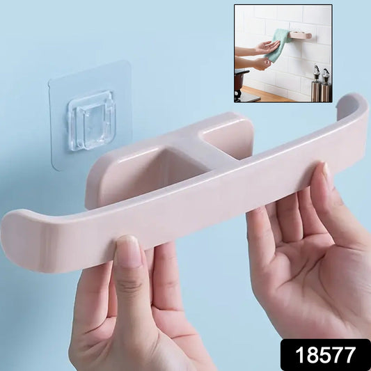 Self adhesive bathroom towel rack being installed on a bathroom wall for convenient towel storage