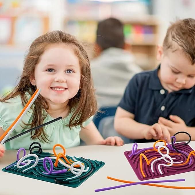 Young children playing with colorful sensory development board for kids to enhance fine motor skills